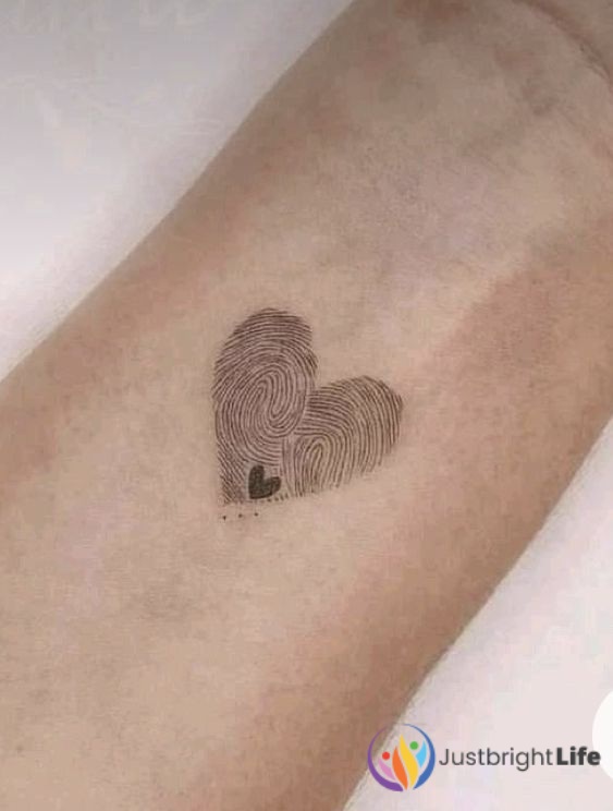Heart With Hands Tattoo